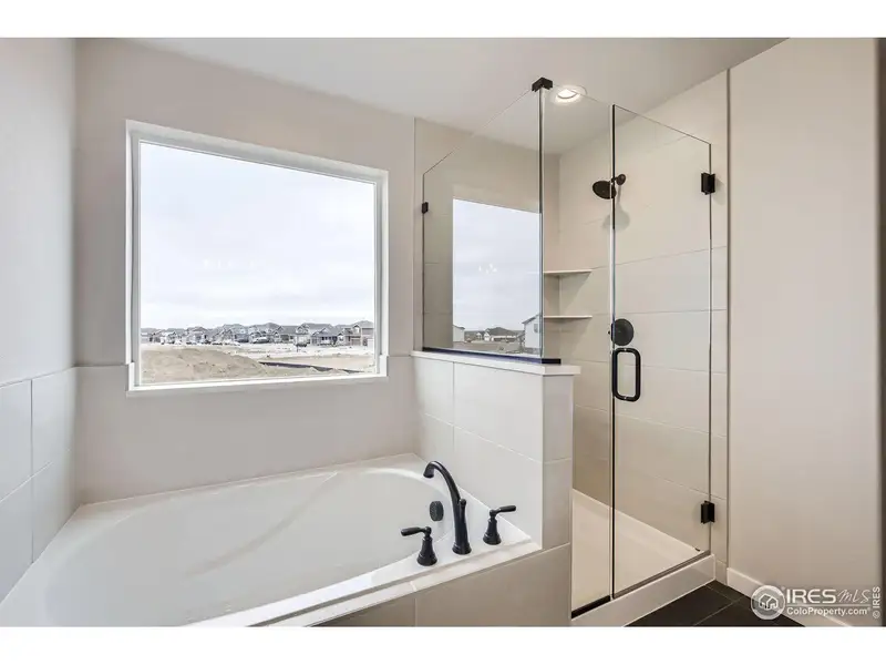 Furnished interior view inside a new home in RainDance, Windsor (Image 13).