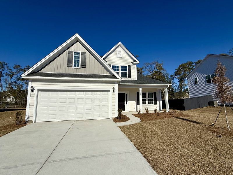 Front exterior of a new home in Allston Park, Calabash, NC, highlighting curb appeal (Image 1). Front exterior of a new home in Allston Park, Calabash, NC, highlighting curb appeal (Image 1).