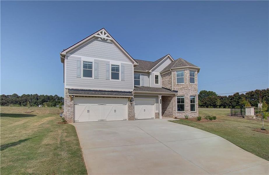 Front exterior of a new home in Grandview at Millers Mill, Stockbridge, GA, highlighting curb appeal (Image 17). Front exterior of a new home in Grandview at Millers Mill, Stockbridge, GA, highlighting curb appeal (Image 17).