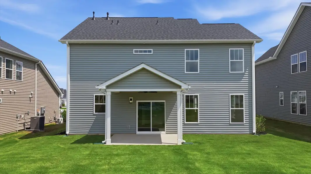 Established charm meets functional outdoor living with a spacious rear covered porch at the Iris Meadows community