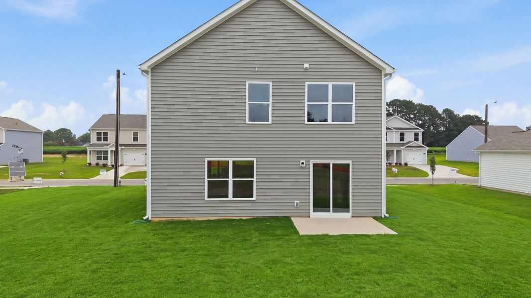 Exterior details and patio area of a home in Hobbs Farm, Ayden (Image 24).