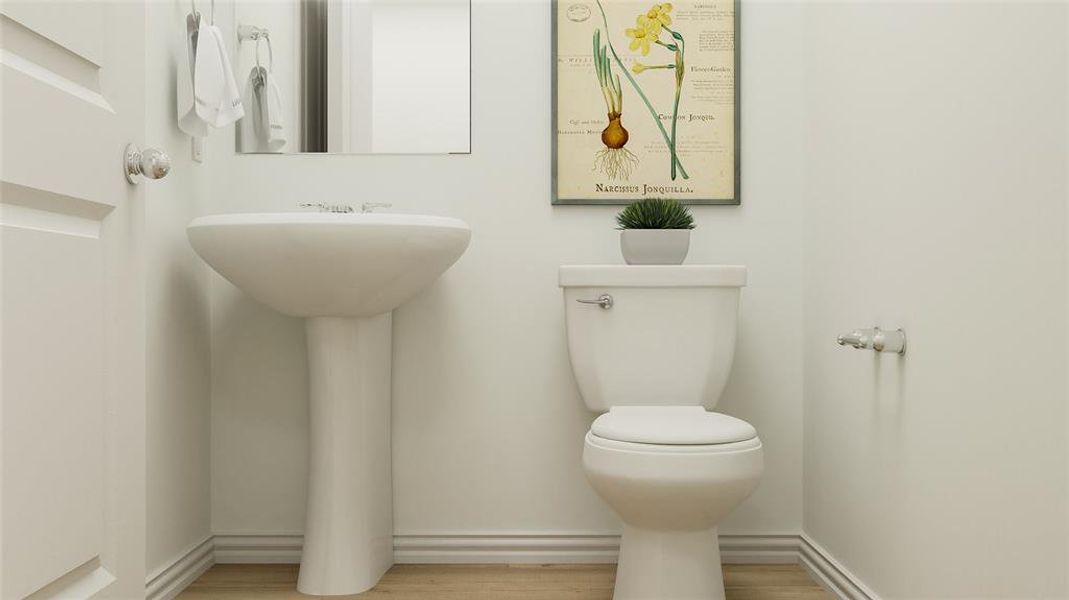 Bathroom featuring hardwood / wood-style floors and toilet