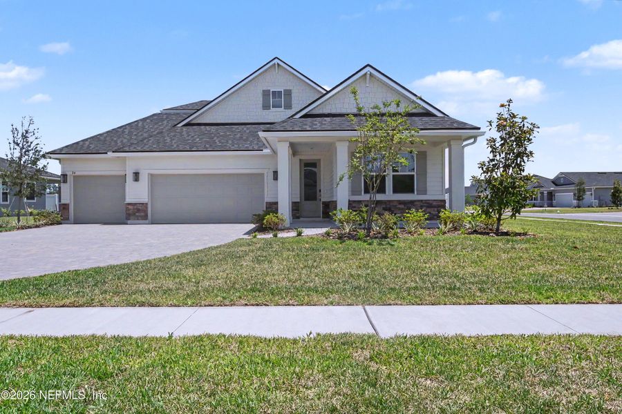 Front exterior of a new home in Brookestone, St. Augustine, FL, highlighting curb appeal (Image 2). Front exterior of a new home in Brookestone, St. Augustine, FL, highlighting curb appeal (Image 2).