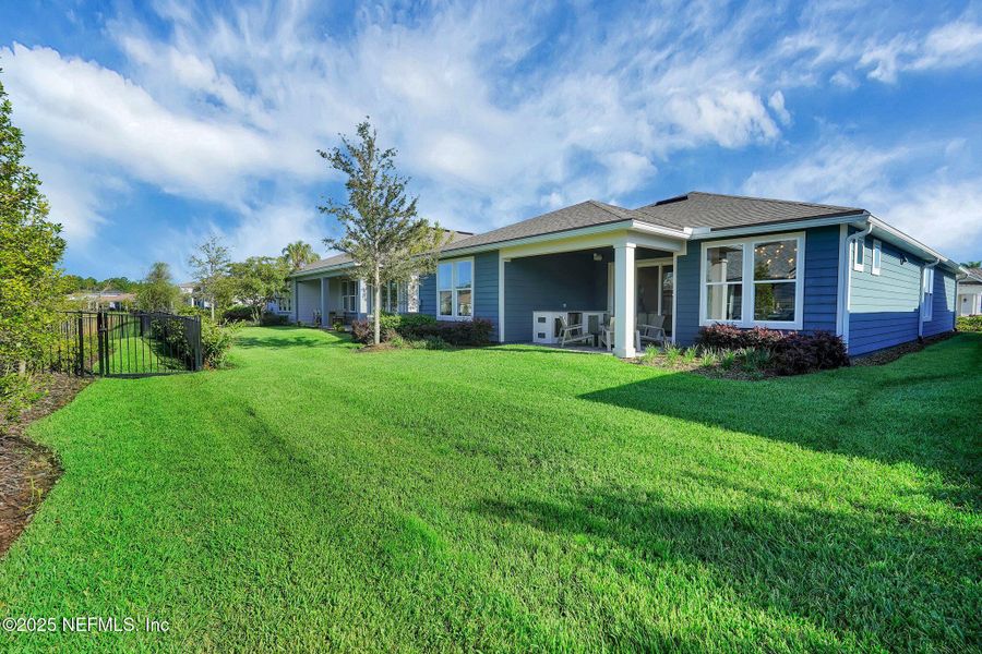 Front exterior of a new home in Summer Bay at Grand Oaks, St. Augustine, FL, highlighting curb appeal (Image 21). Front exterior of a new home in Summer Bay at Grand Oaks, St. Augustine, FL, highlighting curb appeal (Image 21).