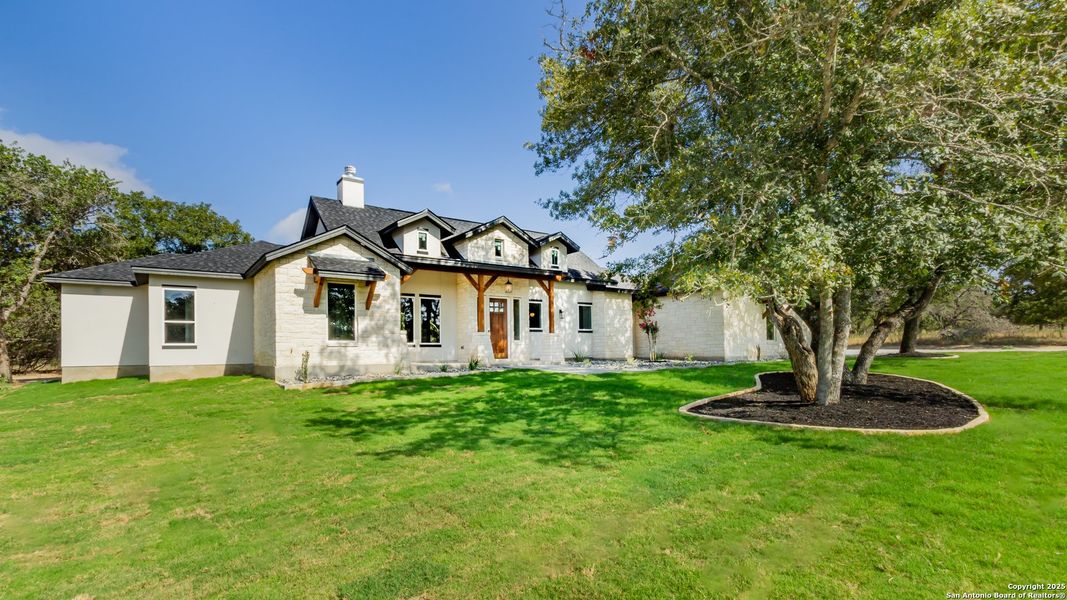 Front exterior of a new home in , La Vernia, TX, highlighting curb appeal (Image 22).