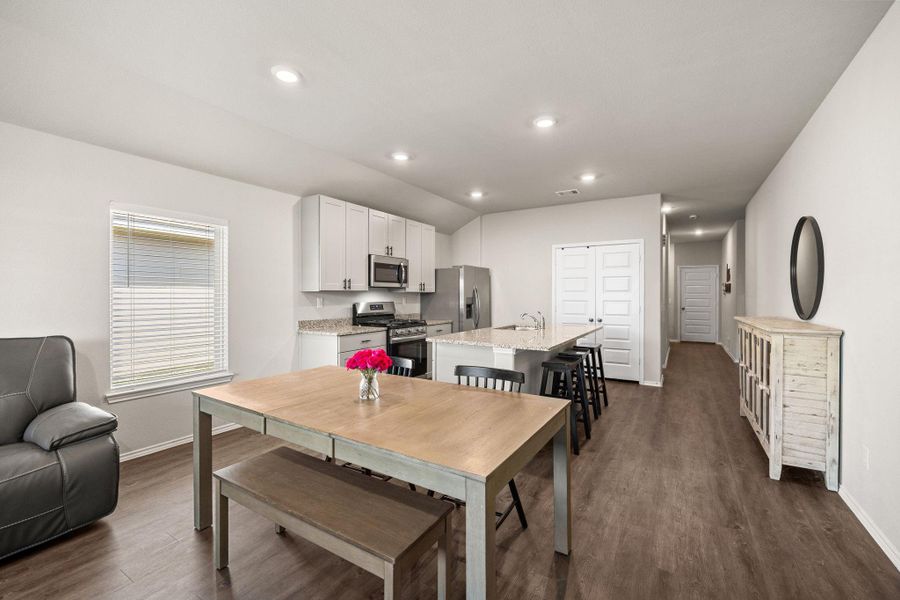 Dining area separates the kitchen and family room
