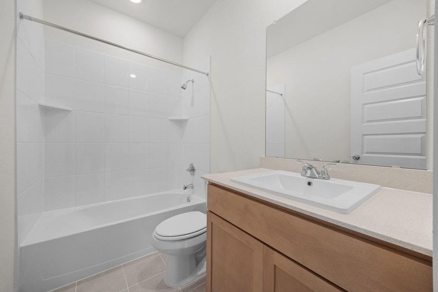 Bathroom in the Sabine home plan by Trophy Signature Homes – REPRESENTATIVE PHOTO