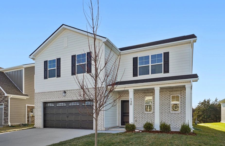 Front exterior of a new home in Ascent at Arbor Ridge, La Vergne, TN, highlighting curb appeal (Image 2). Front exterior of a new home in Ascent at Arbor Ridge, La Vergne, TN, highlighting curb appeal (Image 2).