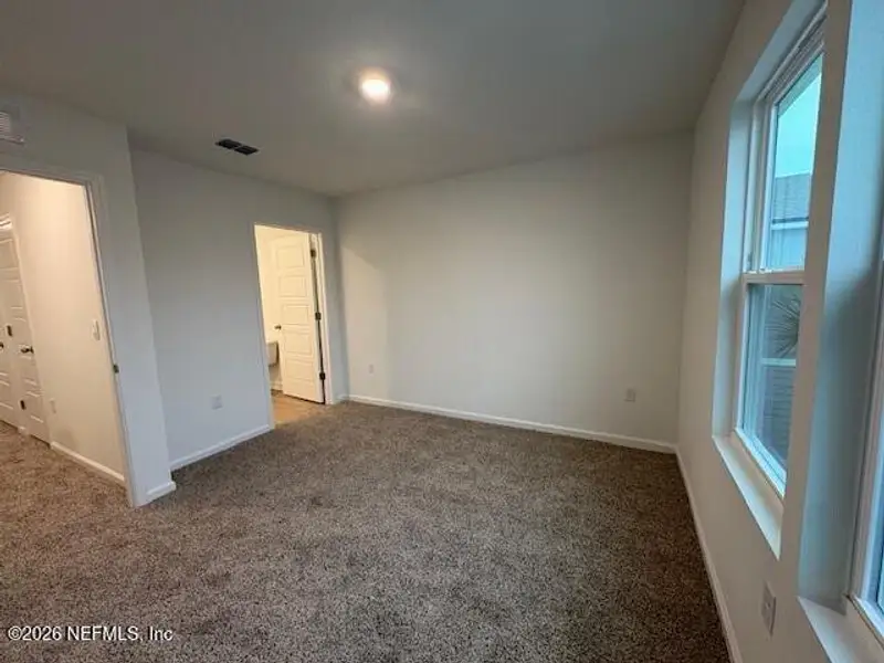 Spacious, unfurnished interior of a new home in Cordera Townhomes, St. Augustine (Image 19).