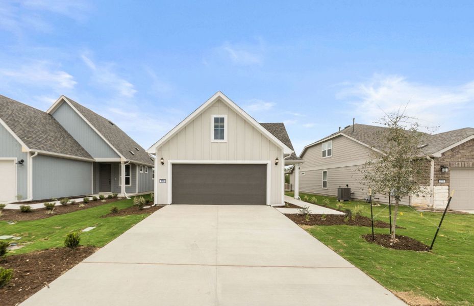 Front exterior of a new home in Sun City Texas, Georgetown, TX, highlighting curb appeal (Image 17).