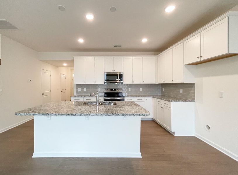 Furnished interior view inside a new home in Bellevue Townhomes, Greenville (Image 7).