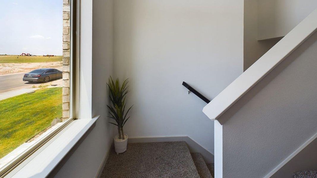Representative furnished interior of a home built from the The Pierce by D.R. Horton in Overlook West, Wolfforth (Image 15).