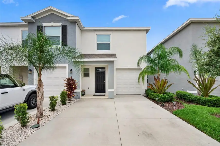 Front exterior of a new home in , Apollo Beach, FL, highlighting curb appeal (Image 25).