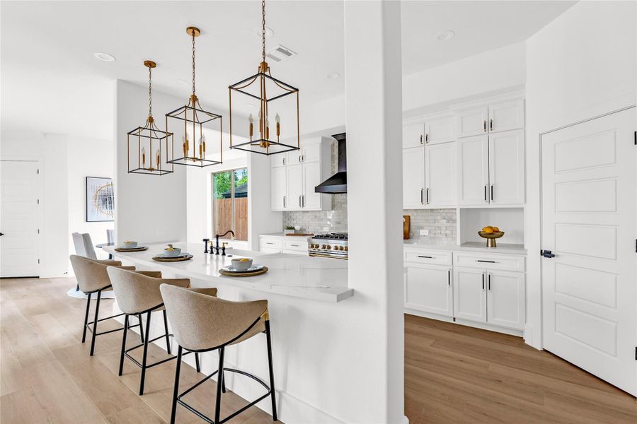 The open kitchen flows directly into the breakfast room.