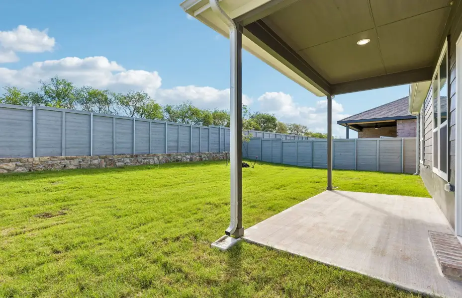 Exterior details and patio area of a home in Treeline, Justin (Image 2).