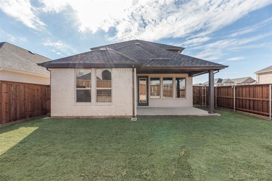 Exterior details and patio area of a home in Spiritas Ranch, Little Elm (Image 4).