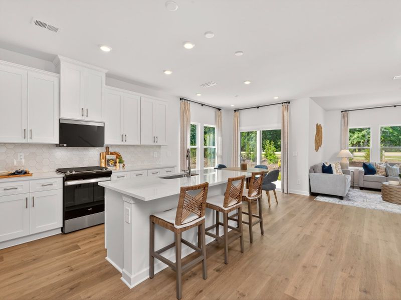 The oversized kitchen island can easily be used as a bar counter for extra seating.