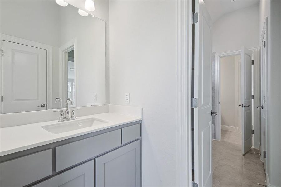 Bathroom with vanity and light tile patterned flooring Bathroom with vanity and light tile patterned flooring