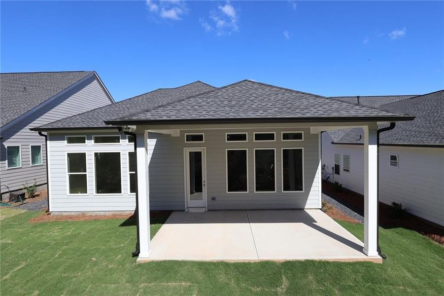 Exterior details and patio area of a home in Maple Grove at Towne Lake, Woodstock (Image 2).