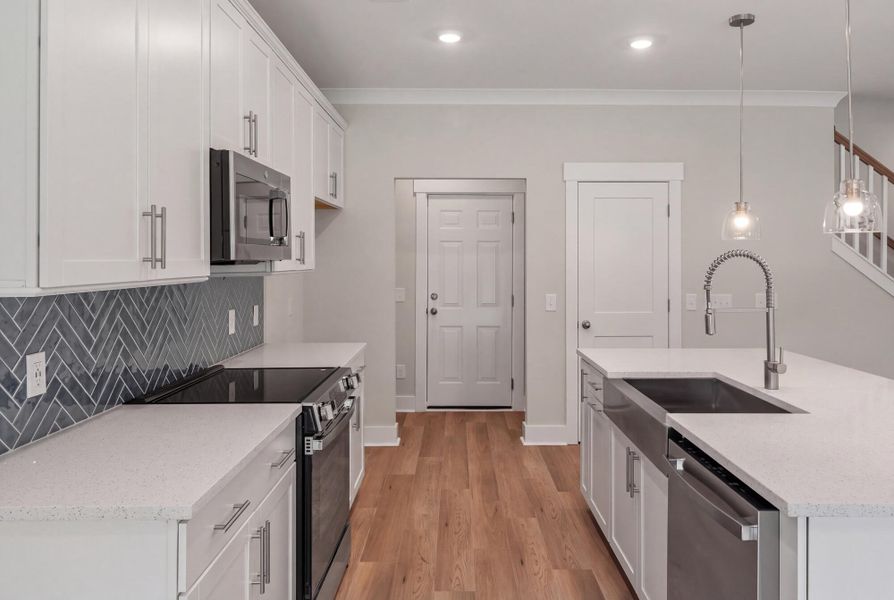 Furnished interior view inside a new home in Academy Park, Beaufort (Image 6).
