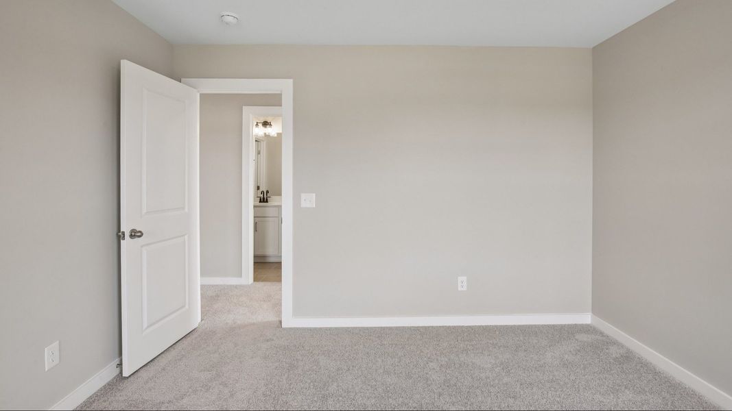 Bedroom with nearby bathroom