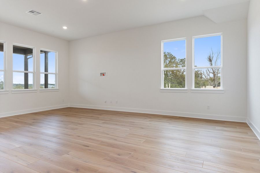 Representative unfurnished interior of a home built from the Waterville by Ashton Woods in The Trails at Carmel, Pflugerville (Image 44).