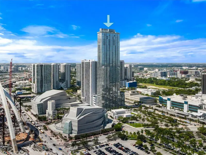 High-rise tower featuring a glass facade and a prominent central location within a metropolitan urban district High-rise tower featuring a glass facade and a prominent central location within a metropolitan urban district