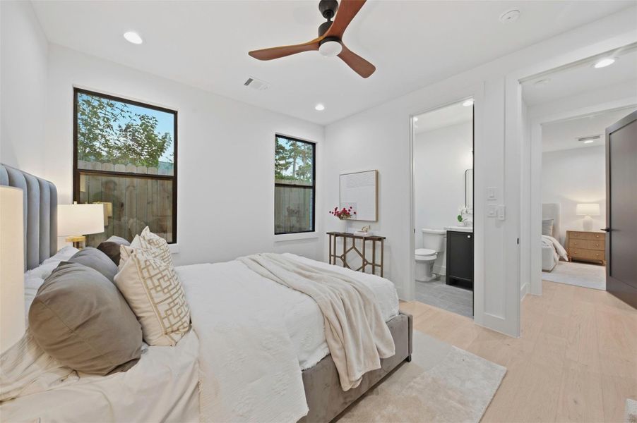 Each secondary bedroom offers direct access to a full private bath, an especially rare feature in Oak Forest.