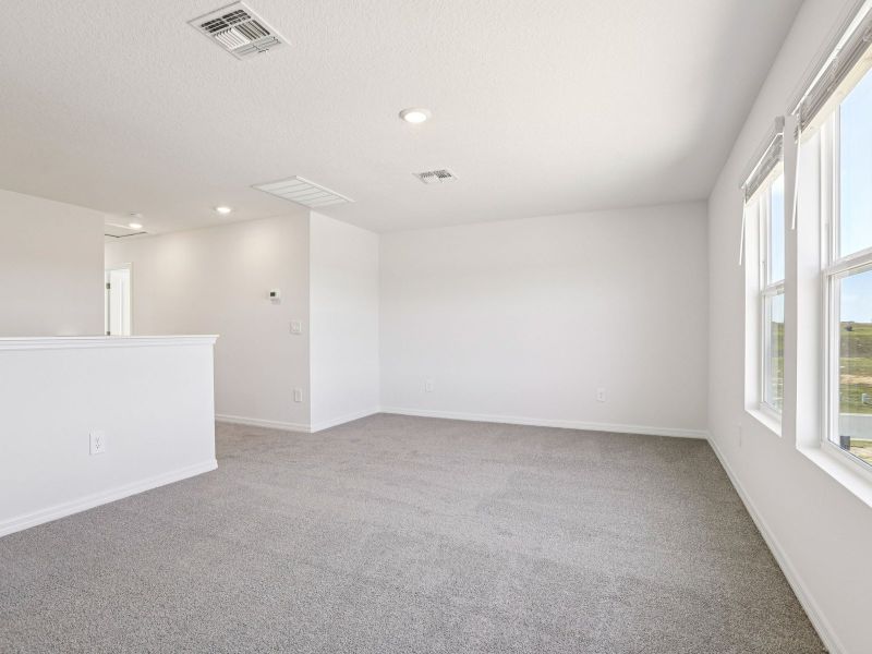 Spacious, unfurnished interior of a new home in The Grove at Stuart Crossing - Classic Series, Bartow (Image 18).