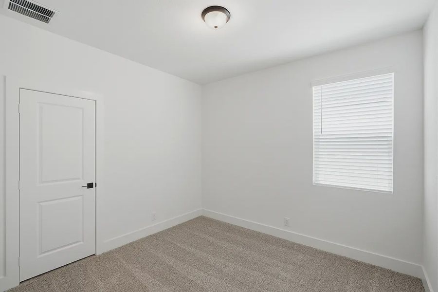 Representative unfurnished interior of a home built from the Athena by Chesmar Homes in Prominence Urban, San Antonio (Image 38).