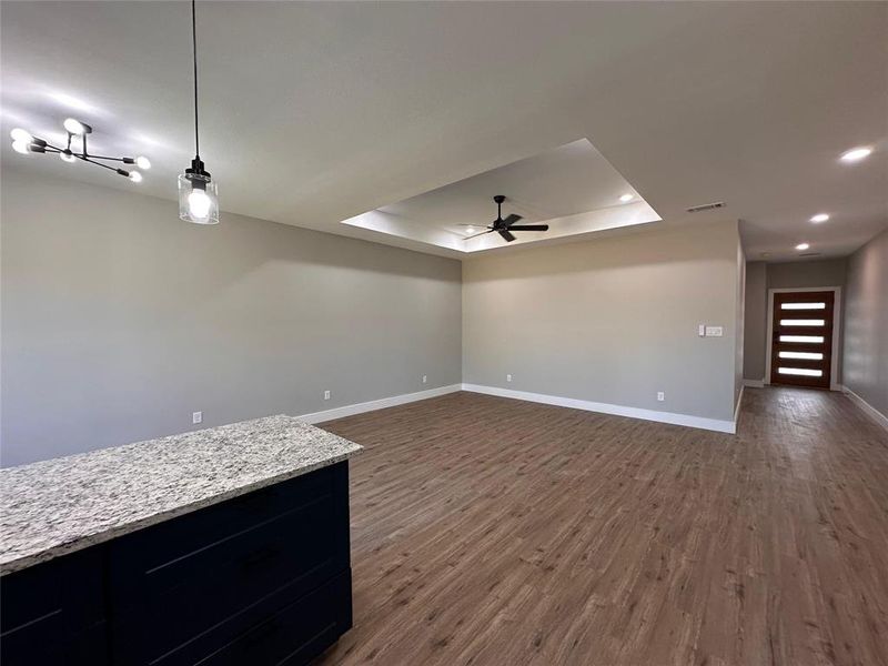 Full view of the main living area from the kitchen area. View of the entry hall.