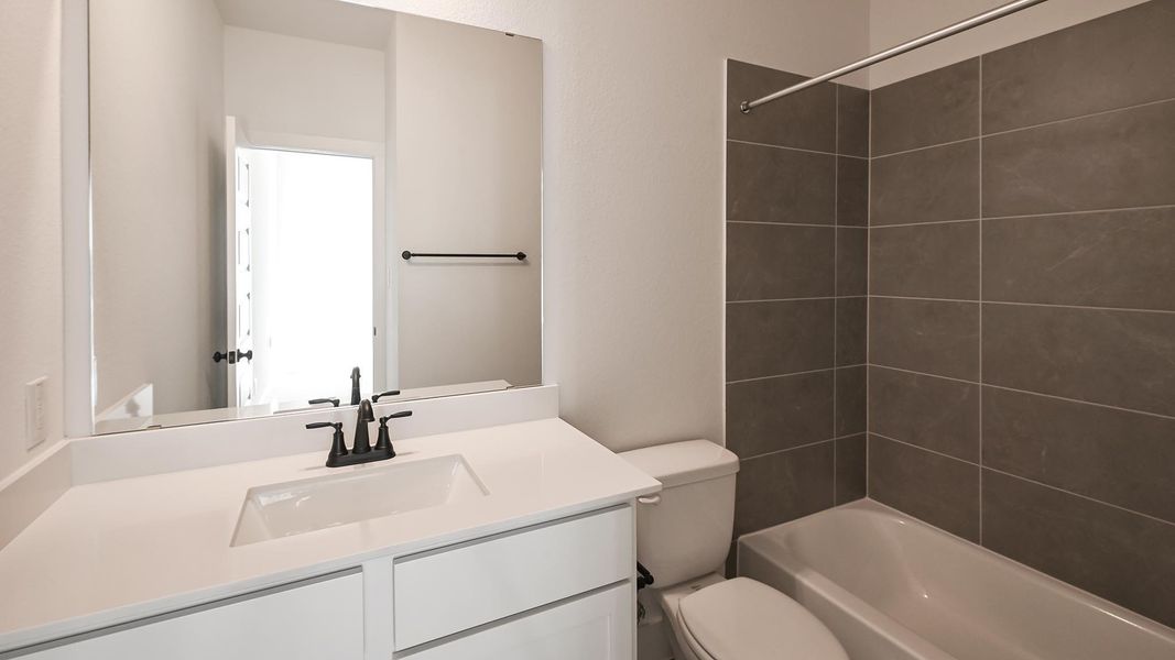 Furnished interior view inside a new home in Crosswinds, Kyle (Image 6).