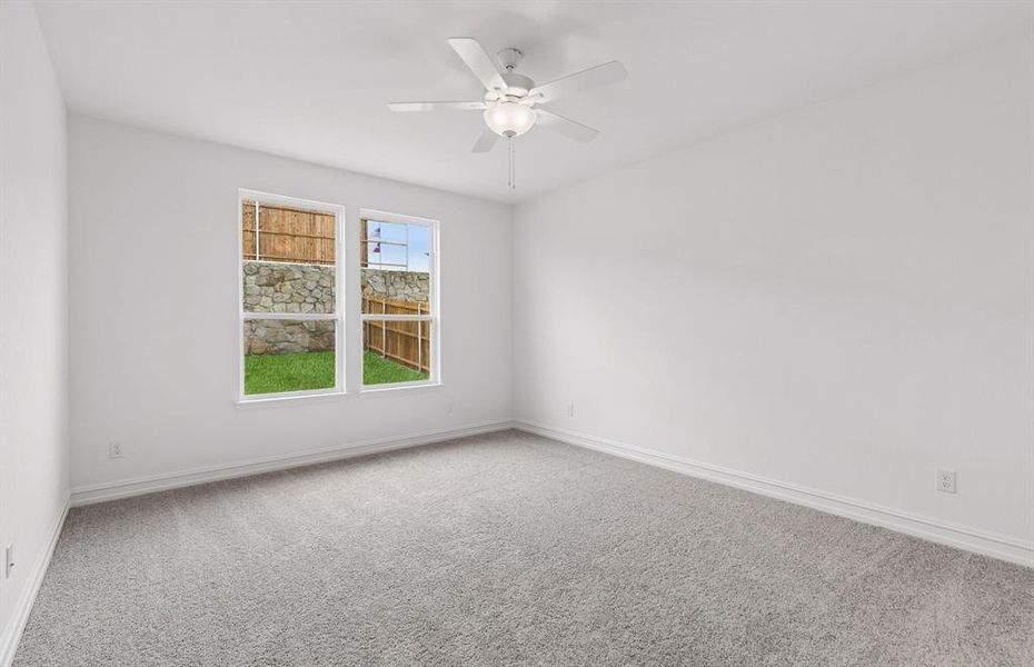 Spacious primary suite with large windows Spacious primary suite with large windows
