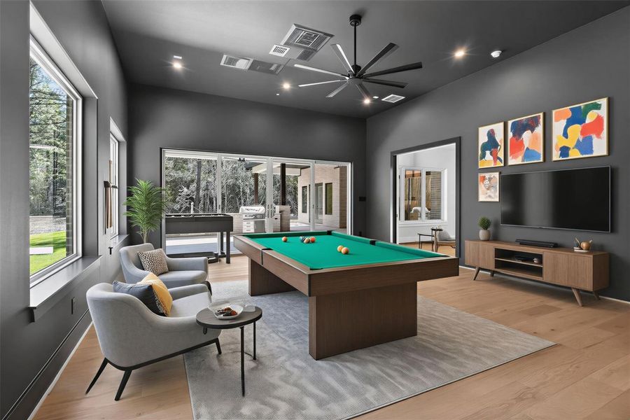 A vibrant game room designed for both entertainment and relaxation, with ample space for billiards, gaming, or lounge seating.