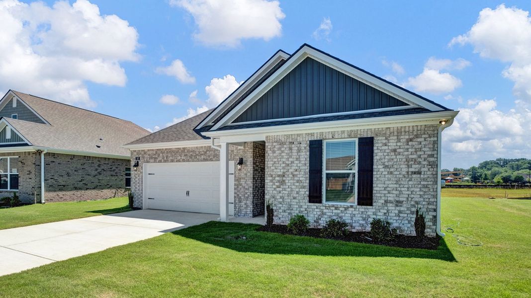 Front exterior of a new home in Shiloh Springs, Jackson, TN, highlighting curb appeal (Image 21). Front exterior of a new home in Shiloh Springs, Jackson, TN, highlighting curb appeal (Image 21).