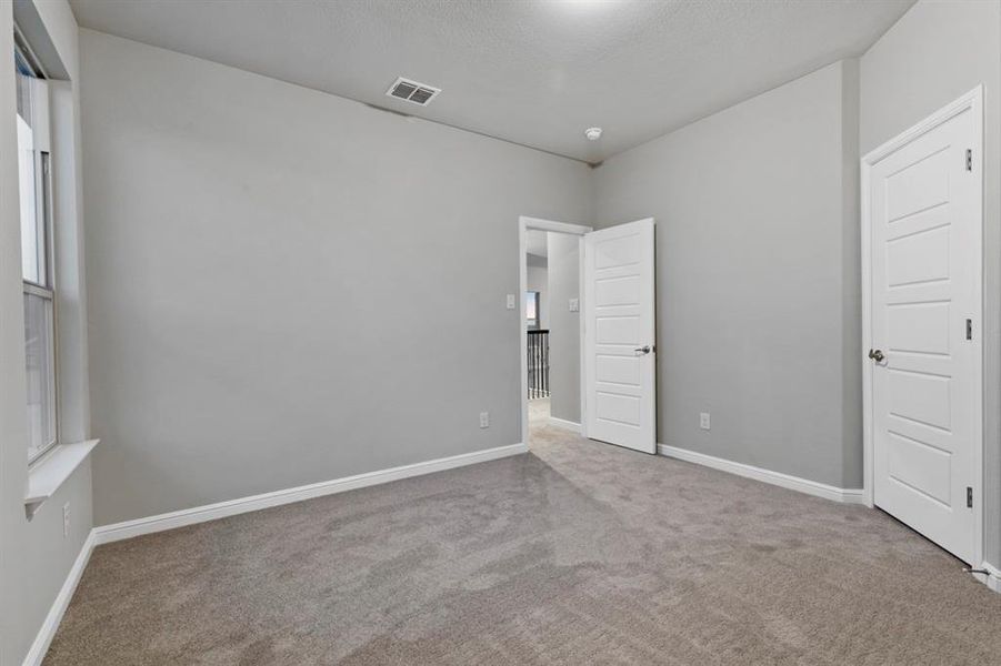 Unfurnished bedroom featuring carpet floors