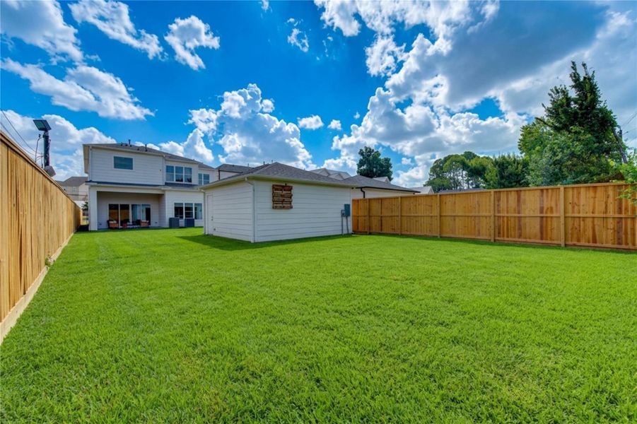 Expansive, fully fenced backyard offers exceptional space and endless possibilities for outdoor enjoyment. The generous lawn provides ample room for a future pool, outdoor kitchen, play area, garden, or custom entertaining retreat—an impressive amount of private outdoor space in the heart of Spring Branch. Expansive, fully fenced backyard offers exceptional space and endless possibilities for outdoor enjoyment. The generous lawn provides ample room for a future pool, outdoor kitchen, play area, garden, or custom entertaining retreat—an impressive amount of private outdoor space in the heart of Spring Branch.