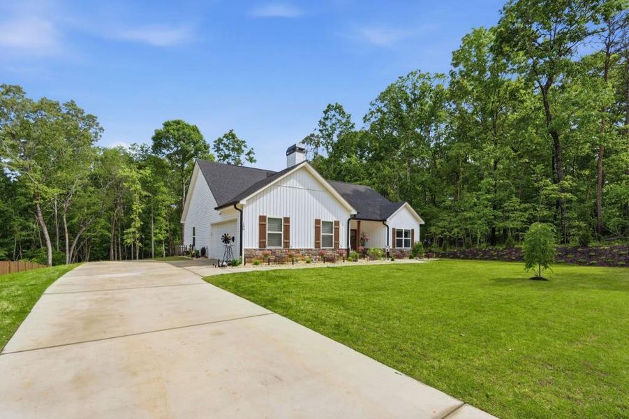 Front exterior of a new home in , Demorest, GA, highlighting curb appeal (Image 24).
