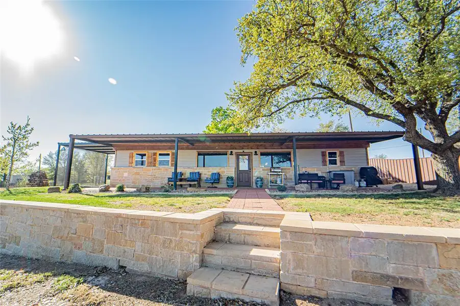 Rear view of house with covered porch Rear view of house with covered porch