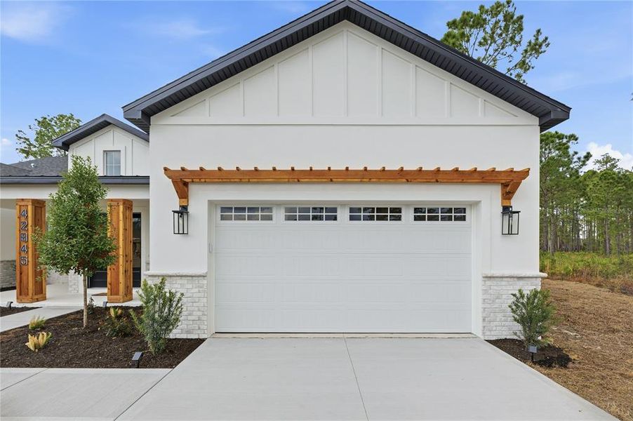 Front exterior of a new home in , Eustis, FL, highlighting curb appeal (Image 25). Front exterior of a new home in , Eustis, FL, highlighting curb appeal (Image 25).