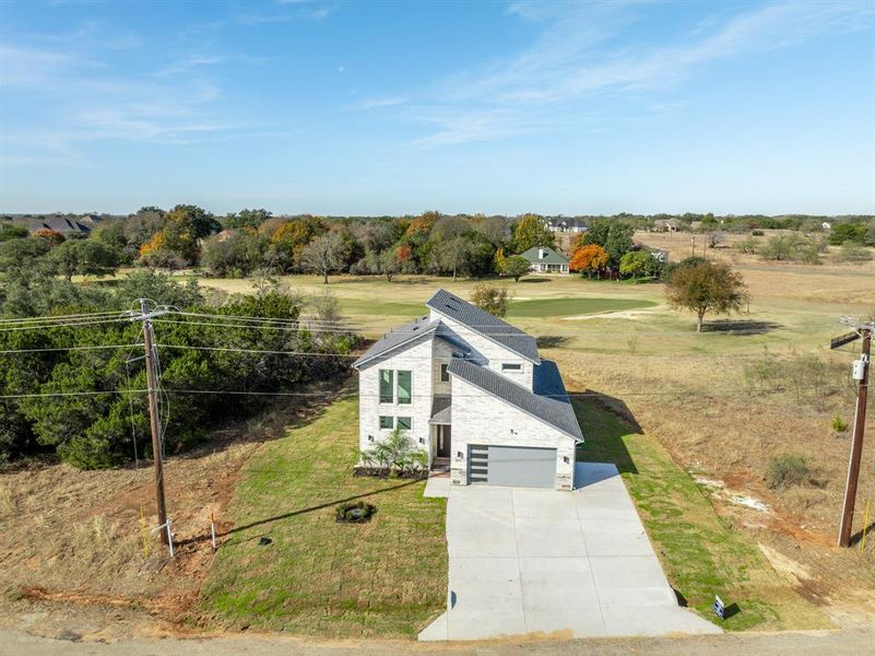 Front exterior of a new home in , Whitney, TX, highlighting curb appeal (Image 2). Front exterior of a new home in , Whitney, TX, highlighting curb appeal (Image 2).