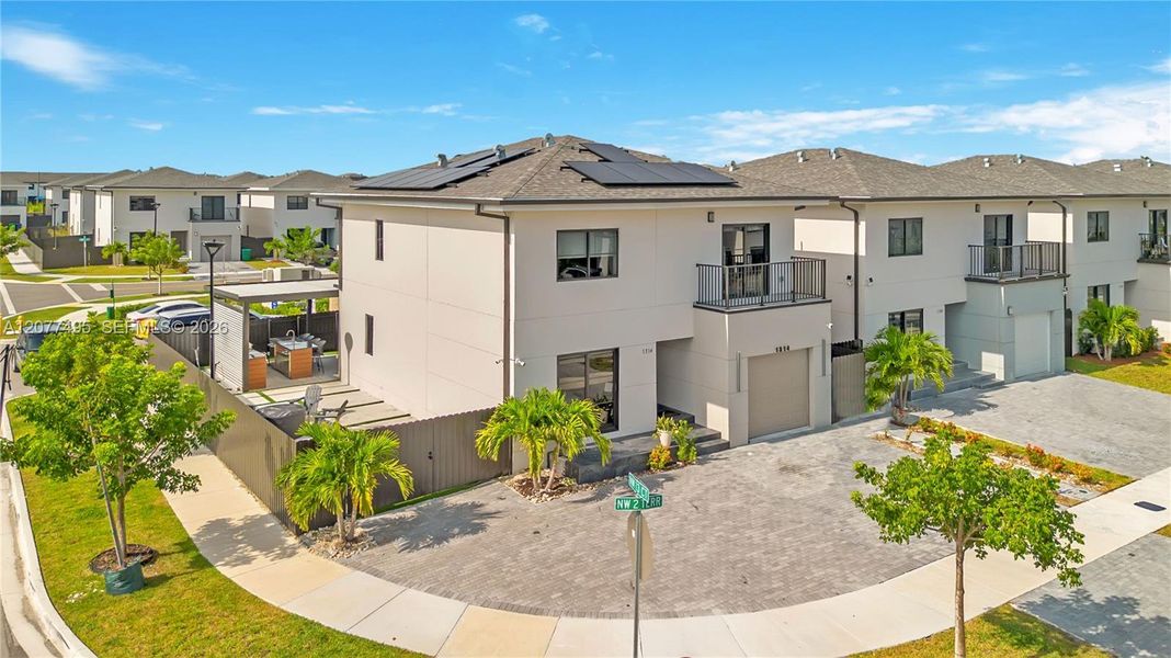 Front exterior of a new home in , Florida City, FL, highlighting curb appeal (Image 1). Front exterior of a new home in , Florida City, FL, highlighting curb appeal (Image 1).