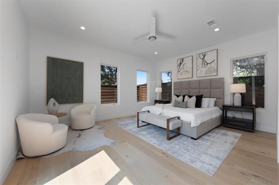 Bedroom with wood finished floors, recessed lighting, and ceiling fan