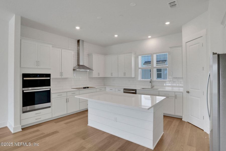Furnished interior view inside a new home in North Beach Townhomes, Jacksonville Beach (Image 9).