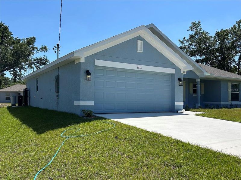 Front exterior of a new home in North Port, North Port, FL, highlighting curb appeal (Image 19).