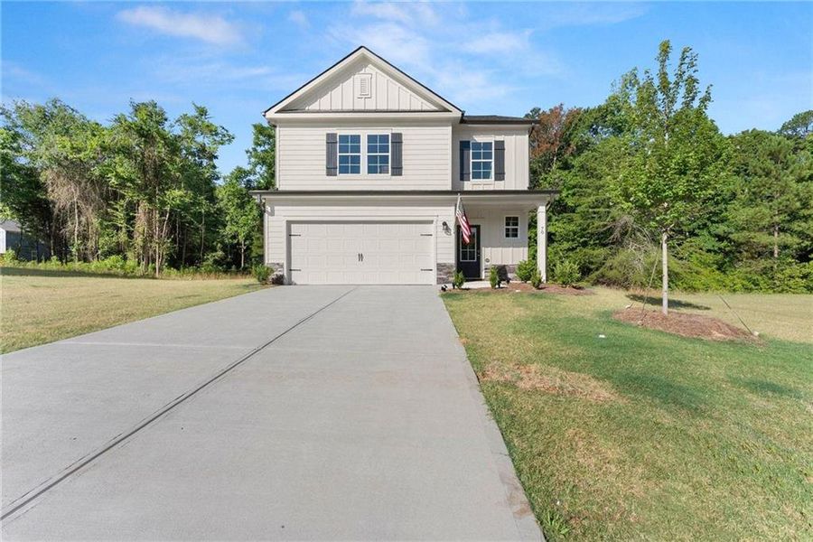 Front exterior of a new home in Ellington Farms, Statham, GA, highlighting curb appeal (Image 24).
