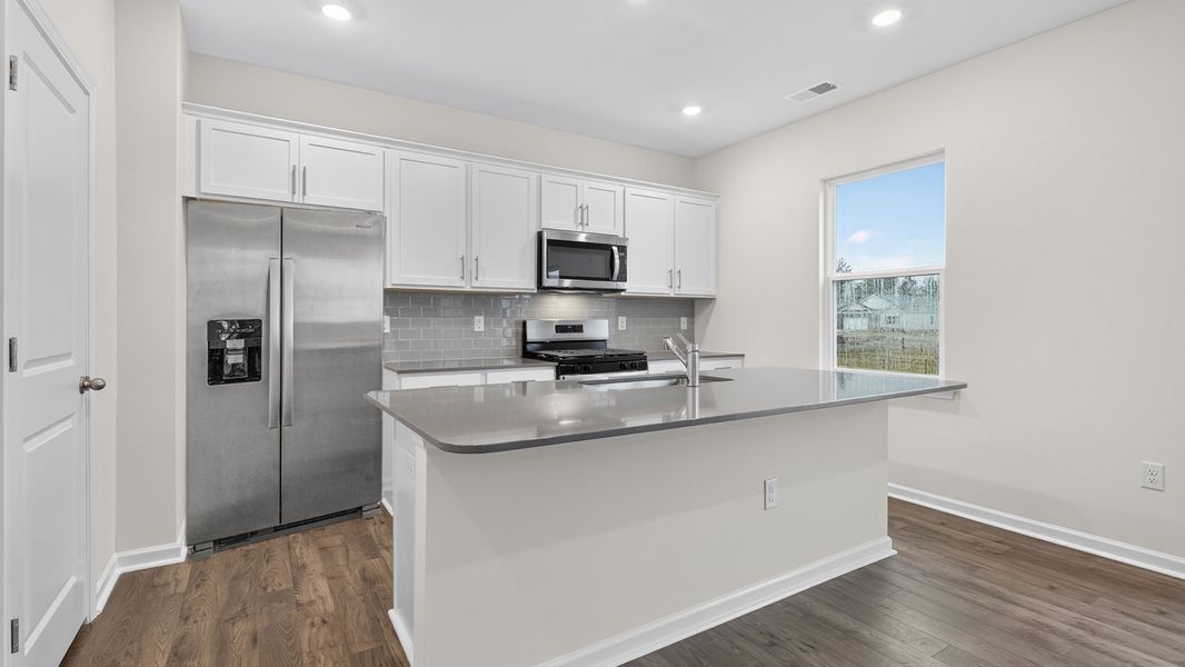 Representative furnished interior of a home built from the BELHAVEN by D.R. Horton in Cross Creek, Spring Lake (Image 7).