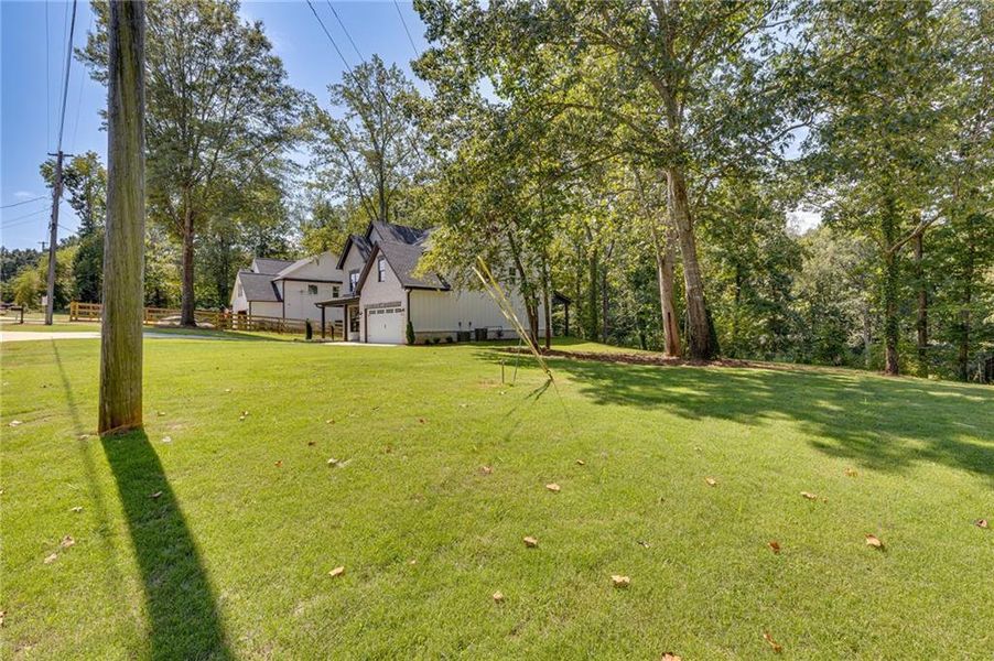 Front exterior of a new home in , Buford, GA, highlighting curb appeal (Image 21).