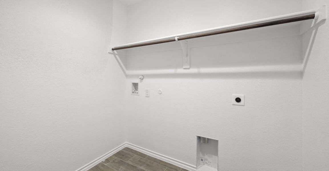 Representative exterior photo of a completed home built from the Lincoln by Impression Homes in Baker Farms, Cleburne, TX (Image 23).