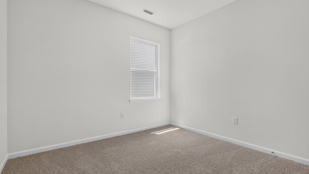 Spacious, unfurnished interior of a new home in The Grove at Matthews Landing, Fuquay Varina (Image 23).